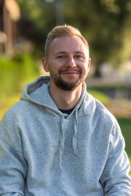 smiley-man-relaxing-outdoors_23-2148739334